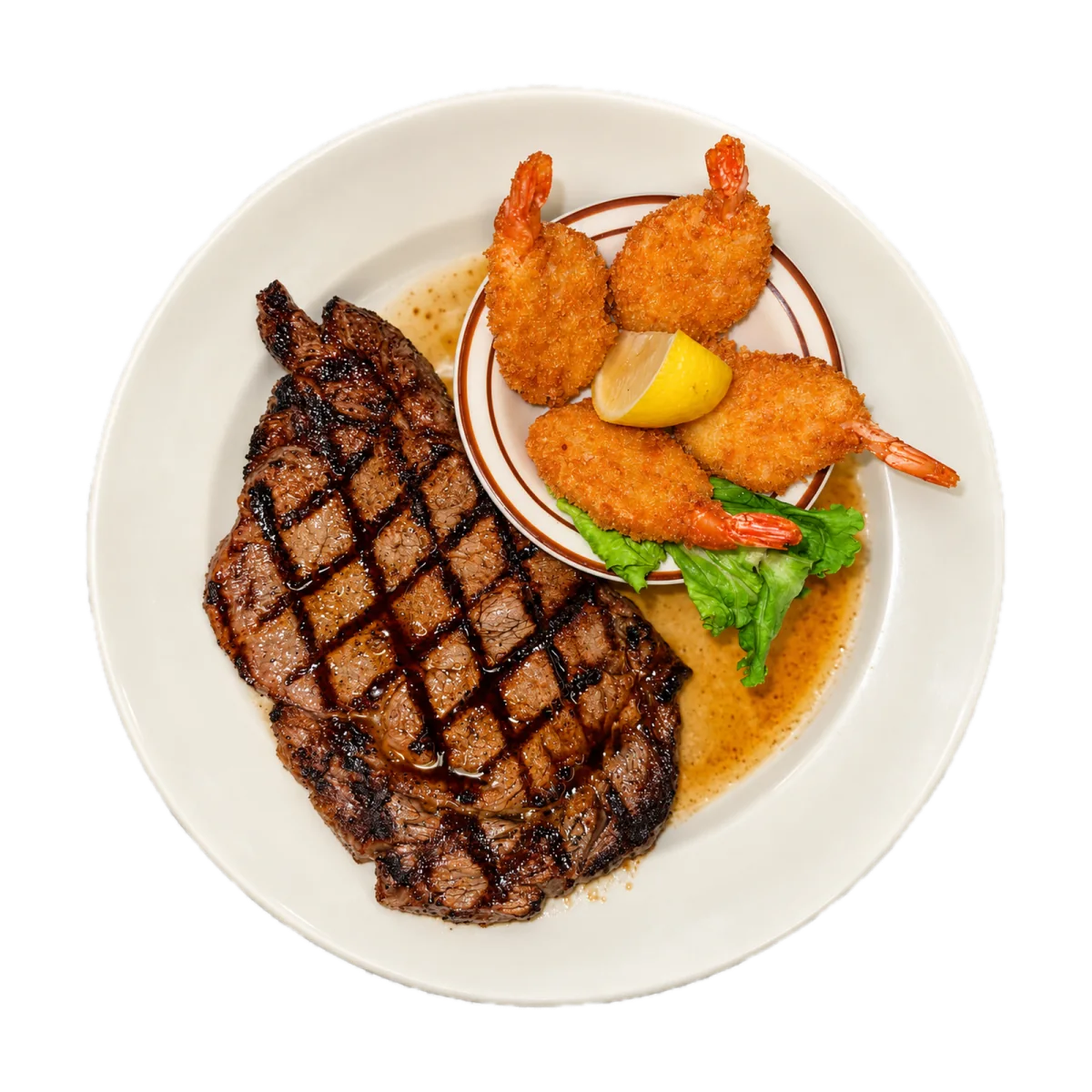 Grilled steak with fried shrimp and lemon